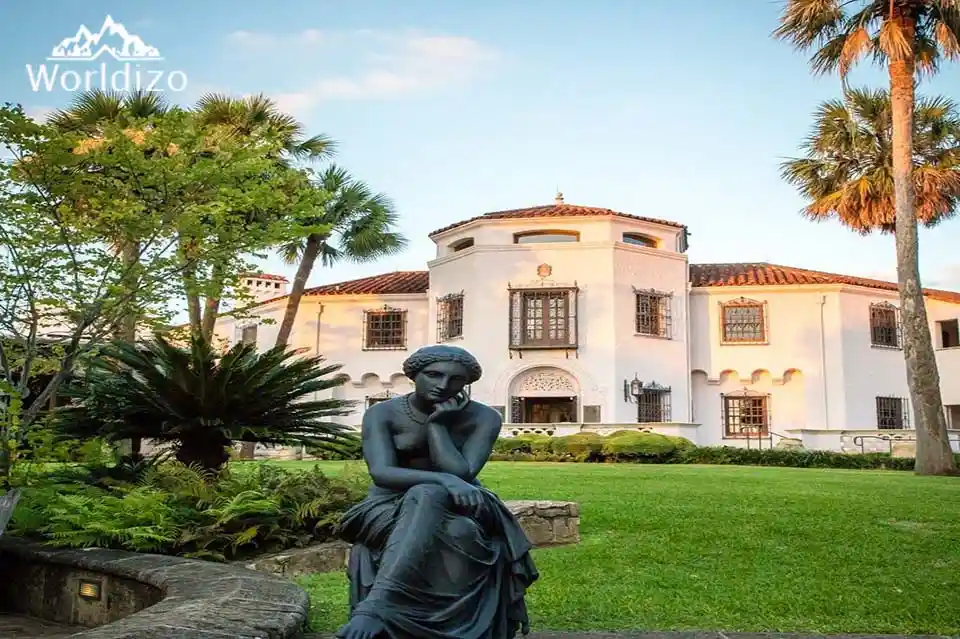 Statue sitting in park of McNay Art Museum